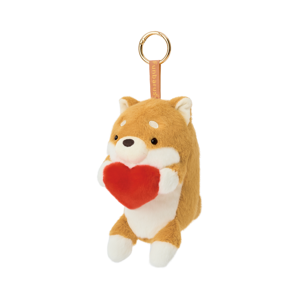 Product image shows Posture Pal Bag Charm, Shiba Inu variant with a brown tag and gold circle clip. Shiba Inu is cream and tan colored, holding a red plush heart between its hands.