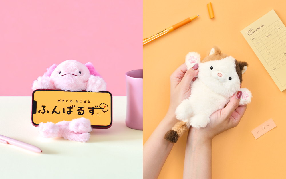 Split image shows two new variants of the Posture Pal Wrist Cushion. Left: pink axolotl holds a cell phone displaying the Posture Pal Funbaru product against a pink wall beside a pink pen and mug. Right: against a yellow table top, surrounded by yellow items, hands hold the Calico Cat variant's paws open